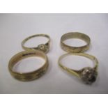Three 9ct gold rings to include two bands and one inset with a diamond, 5.5 grams, together with