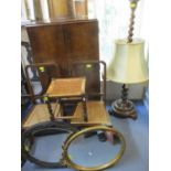 A Victorian ebonized oval mirror A/F and one other, mixed furniture and other items