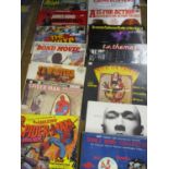 A collection of 1960s and 1970s theme tune music LPs for popular films and television shows to