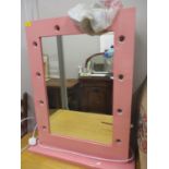 A contemporary pink, free standing mirror with electrics to fit ten light bulbs, to the surround,