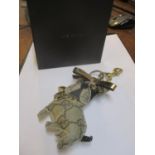 A Gucci Grey GG canvas novelty keyring in the form of a dog with gold coloured metalware and branded