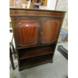 A modern mahogany side cabinet with brass inlaid stringing, twin cupboard doors revealing a fitted