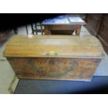 An antique pine domed trunk with painted decoration and date 1776, with iron carrying handles and