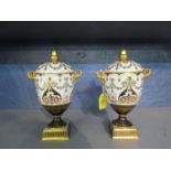 A pair of 19th century Wedgwood neoclassical covered urns, twin based garland ring and mask