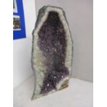 A large natural amethyst rock 19 1/2" high
