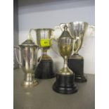 Three silver trophy twin handled cups, two on stands and a silver plated trophy. Total weight 468.9g