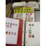 Three stamp albums from around the world and a quantity of first day covers, together with a stamp