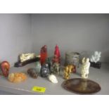 A mixed lot of oriental items to include a Chinese carved chess piece, netsukes and other items