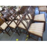 Two reproduction carvers and six matching dining chairs with drop-in striped seats