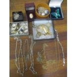 A mixed lot of silver and costume jewellery to include a silver bar, silver rings, Art Deco ladies