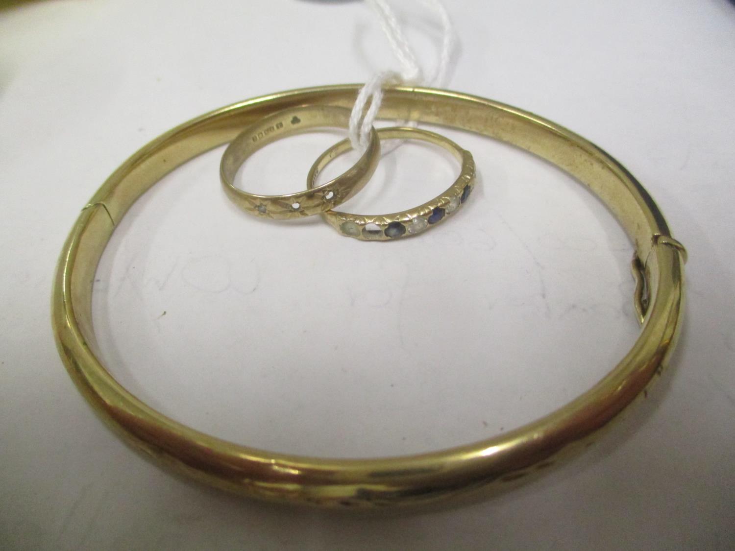 Two 9ct gold rings together with a 9ct gold bangle, 12.95 grams