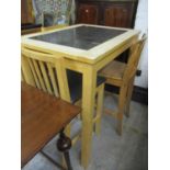 A modern beech kitchen high table with an inset marble top, a pair of chairs and another pine