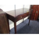 A reproduction mahogany side table with single long drawer
