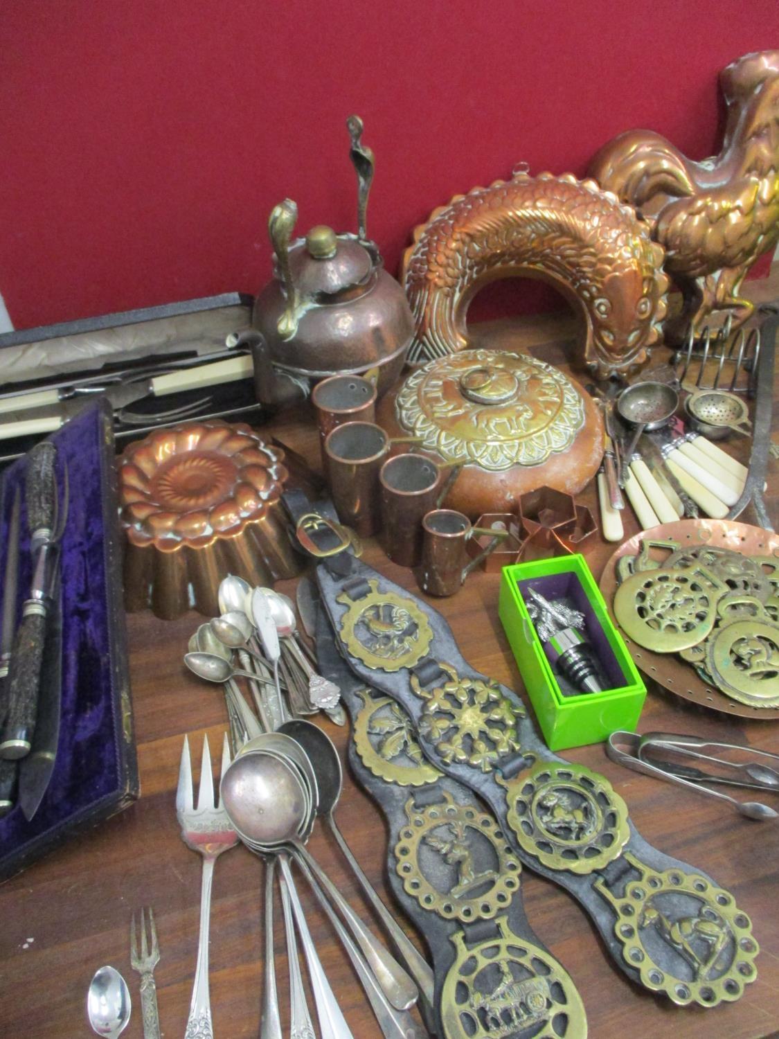 Metalware to include copper jelly moulds, an Arts & Crafts kettle, cutlery and flatware, silver