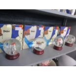 Four Coalport characters, snow globes of The Snowman (with boxes)