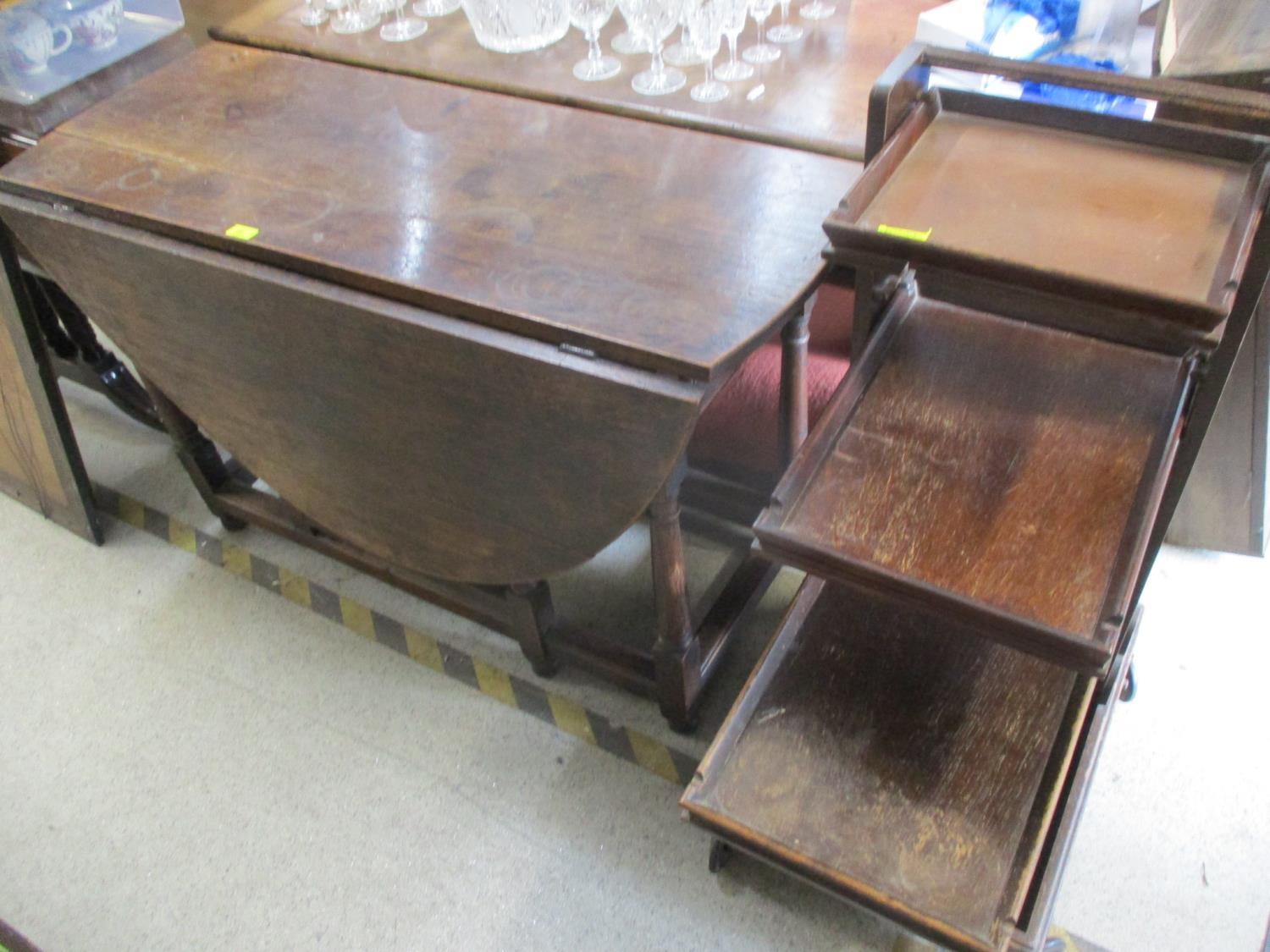 A compactum oak finished, four tier tea trolley with three detachable trays and an 18th century