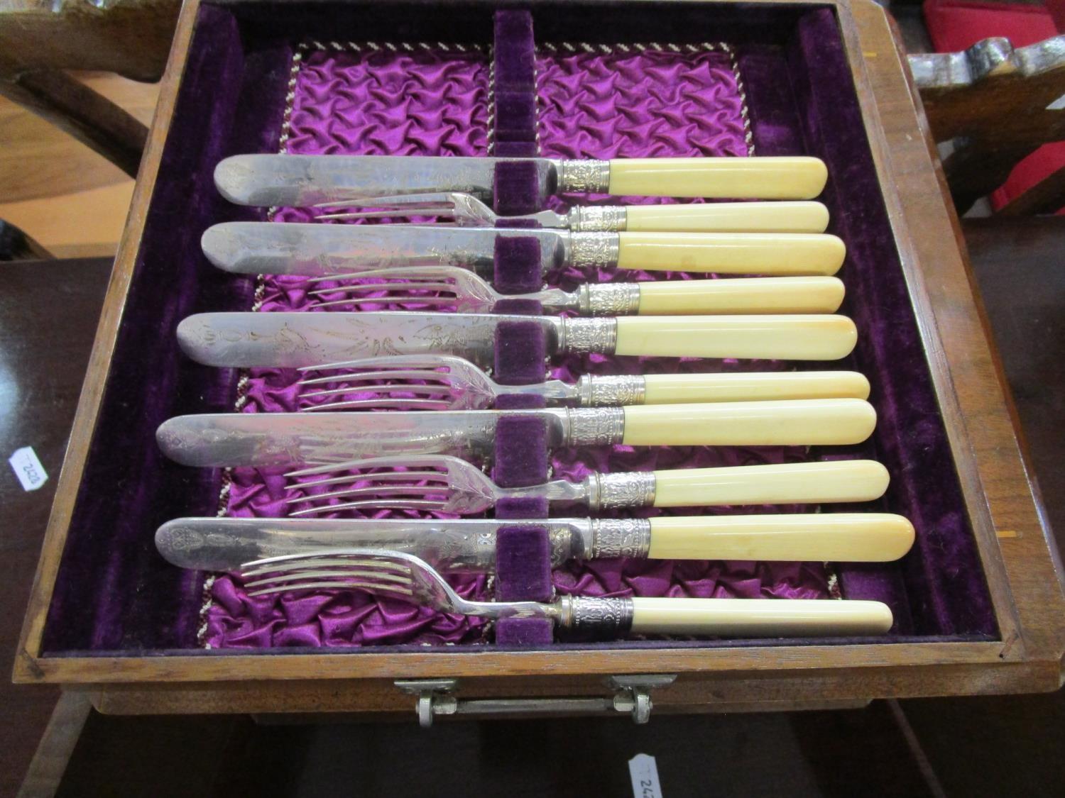 A Victorian walnut cased canteen of silver plated cutlery, three drawers containing a front set with - Image 4 of 7