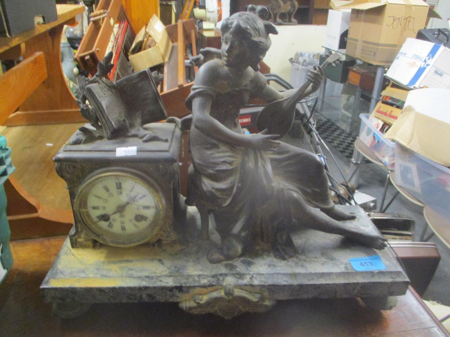 A late 19th century French spelter and marble mantle clock fitted with a Japy Freres 8-day count