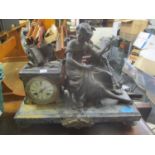 A late 19th century French spelter and marble mantle clock fitted with a Japy Freres 8-day count