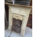 A Victorian cast iron white painted fire surround with grate 36 1/2"h x 28 3/4"w