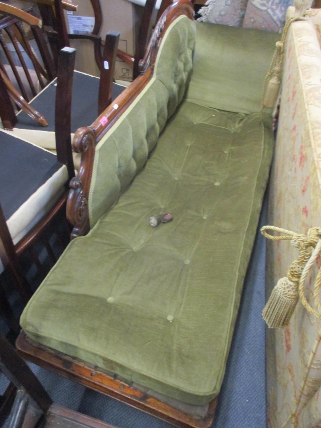 A Victorian walnut green button back upholstered chaise longue on turned feet 35" H x 67" W