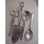 Three pieces of silver to include a pair of scissor sugar tongs, together with a white metal