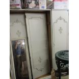A French cream painted triple wardrobe
