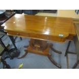 A reproduction walnut finished side table having two inset drawers above lyre supports on a