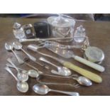 A mixed lot of silver plate to include a candle snuffer, a miniature clock, cake knife, sugar tongs,
