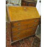 A Georgian oak bureau having a fall flap above four graduated drawers, 41 3/4"h x 36 1/2"w