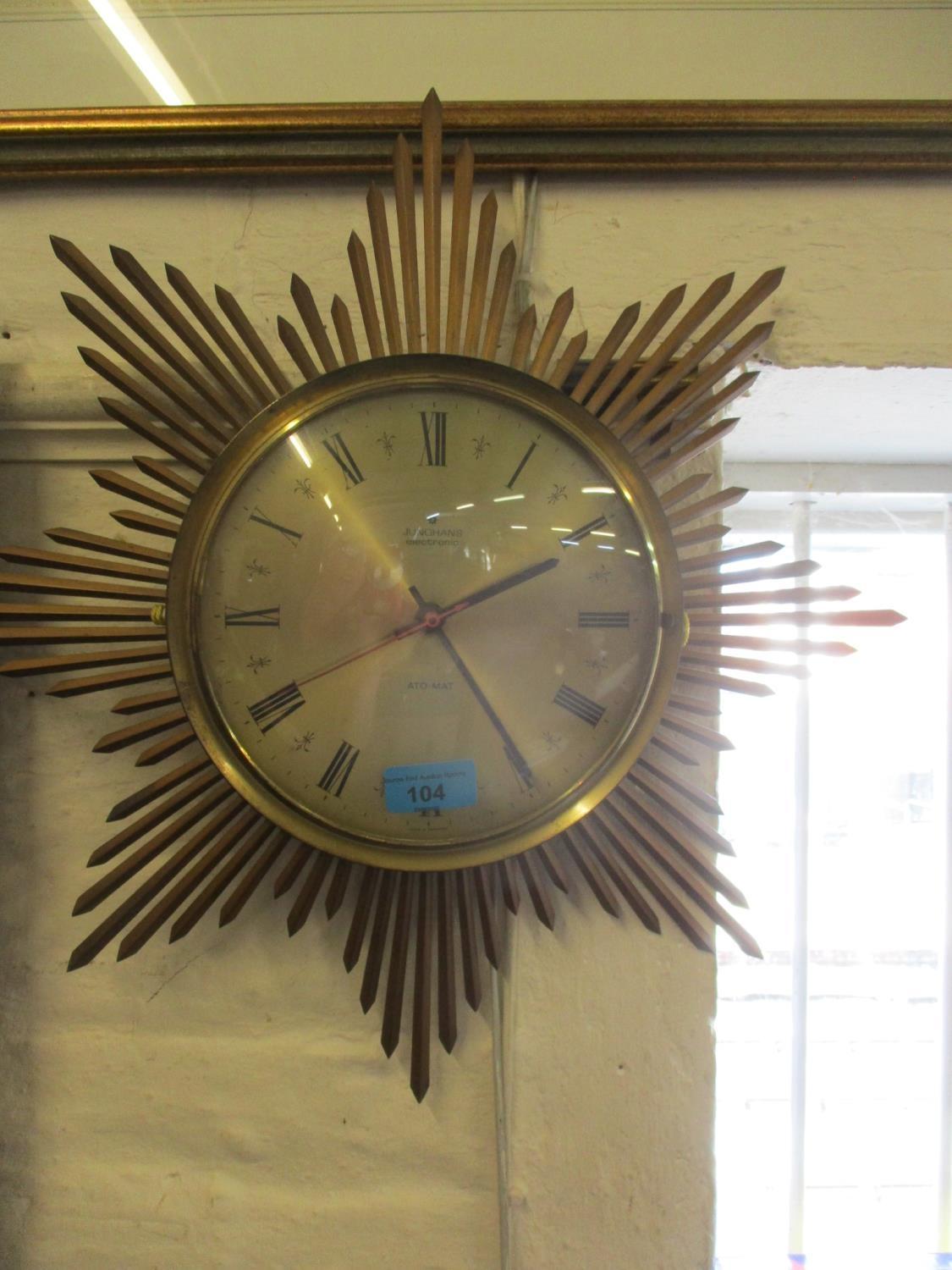 A Retro battery operated sunburst wall clock by Junghans