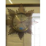 A Retro battery operated sunburst wall clock by Junghans