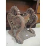 A Victorian cast iron boot scraper of foliate cast symmetrical form