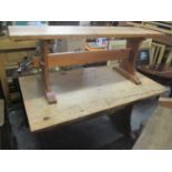 A pine trestle end dining table 29"h x 48"w, and two pine benches