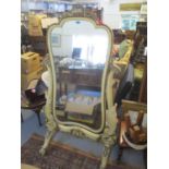 A reproduction French large painted cheval mirror having floral carved decoration and scroll