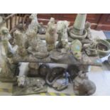 A selection of composition garden ornaments to include owls, dogs, ducks and others