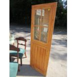 A Victorian pine corner cabinet with glazed display door above a panelled cupboard door 72" x 24 5/