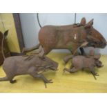 Three metal garden models of warthogs