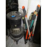 A mixed lot to include a Valor heater, mixed gardening tools and a workbench