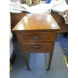 An Edwardian inlaid walnut side chest with two drawers on square, tapering legs and metal castors,