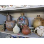 A collection of pots and vases depicting worldwide styles, all signed Maria