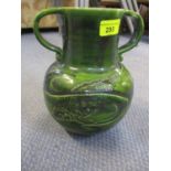 A green glazed art pottery, twin handled vase stamped indistinctly to the base, depicting a carp