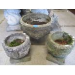 A composition garden planter, 13"h x 15 1/2"w and a pair of smaller planters, 10" h x 9 1/2"w