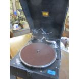 An HMV table top portable gramophone in a black case, the handle has the knob missing, model no