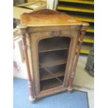A late Victorian walnut music cabinet with a ceramic plaque flanked by turned pillars 41 1/2"h x