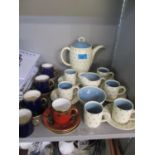 A Susie Cooper six setting in complete coffee service having a cream ground and blue star flower