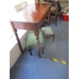 A Victorian mahogany side table on ring turned legs and two later stools on cabriole legs