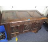 A 17th century oak panelled coffer having a hinged top with inset candle box, 28" h x 43 1/4"w