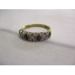 A 18ct gold sapphire and diamond half eternity style ring