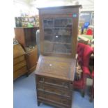 A small oak bureau bookcase with astrigal leaded door